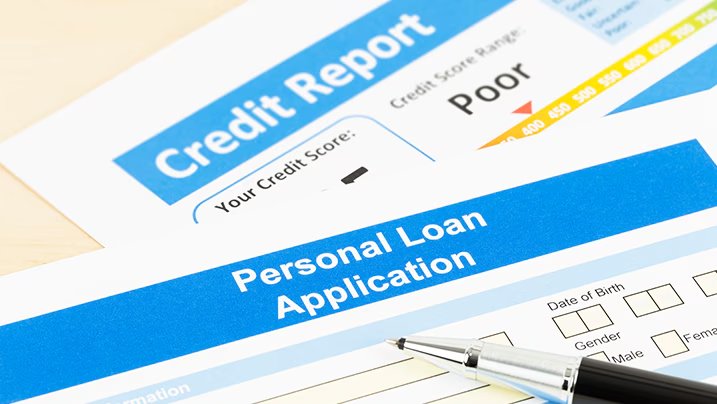 Personal loan application form placed on a credit report